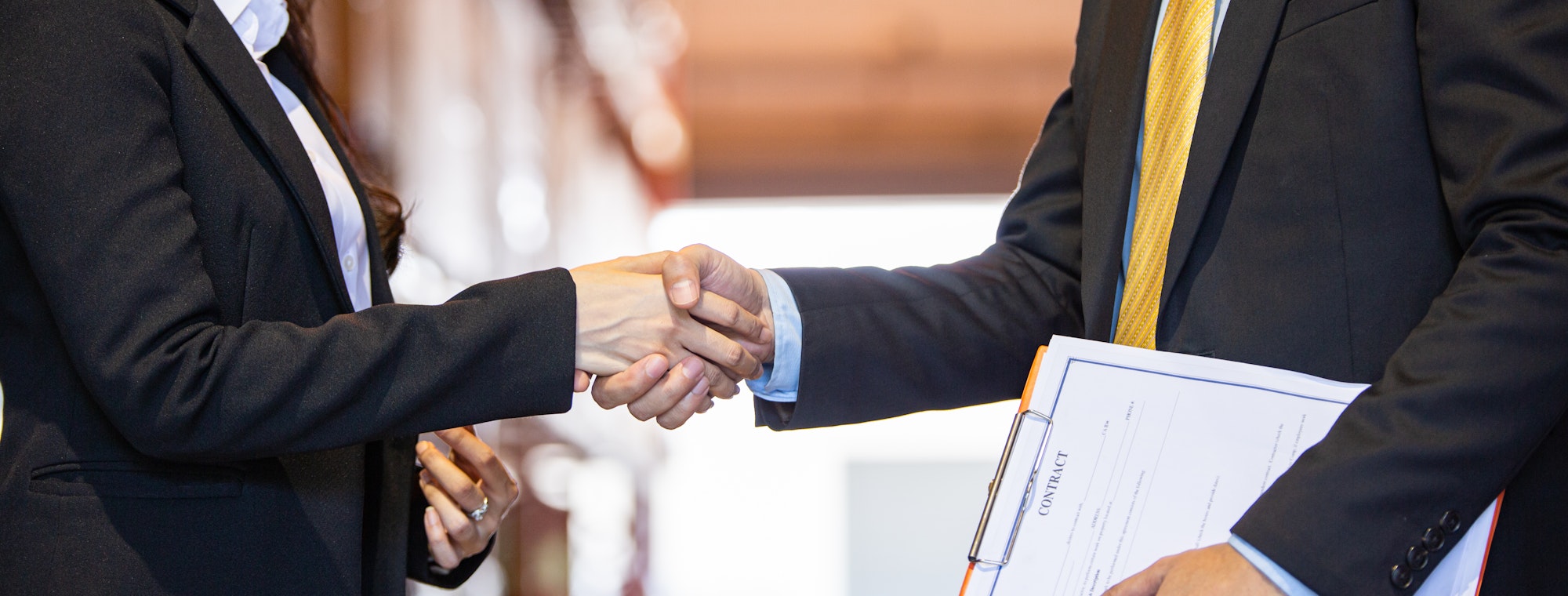 Business people handshake to greeting or closing deal