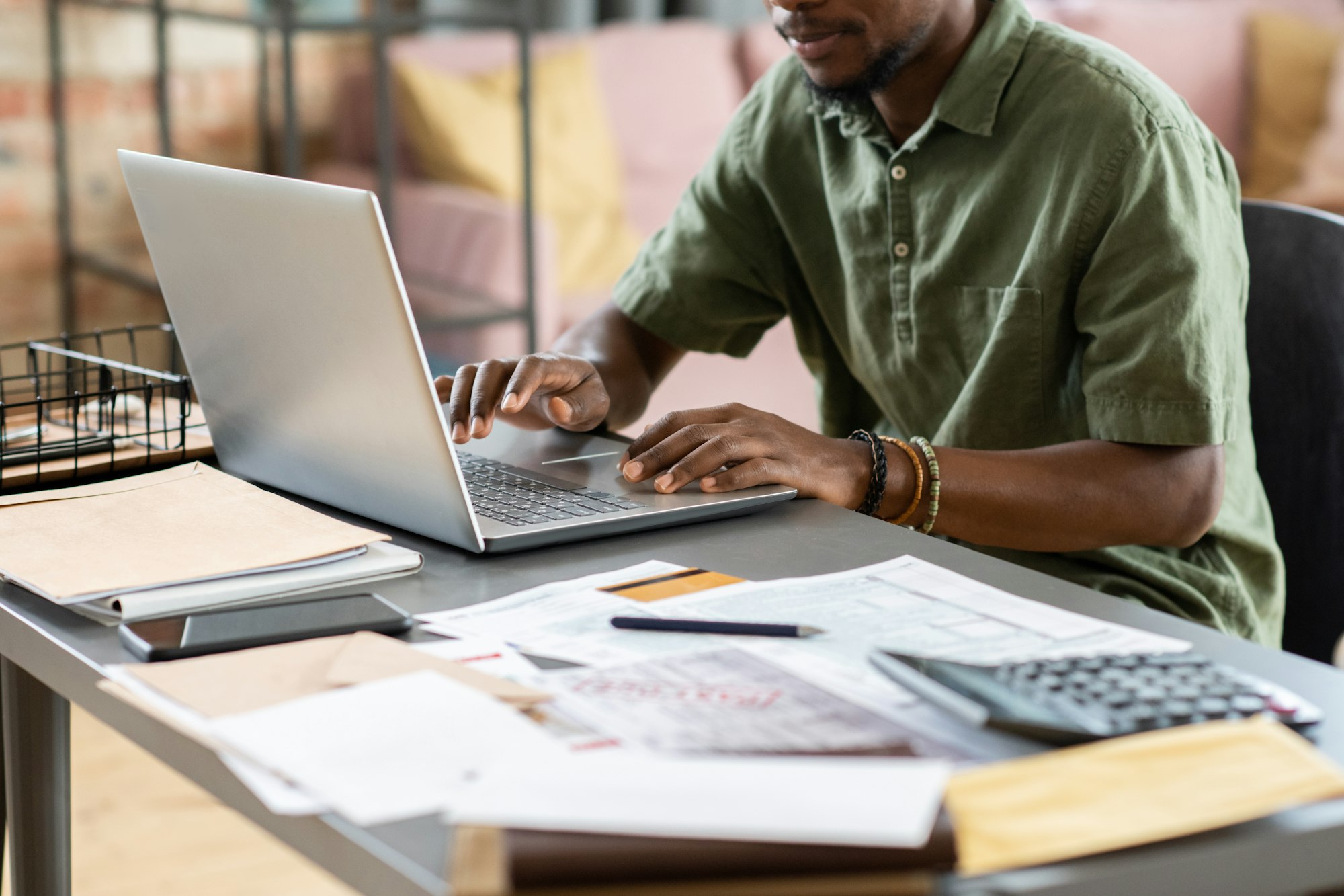 Manager Examining Files On Laptop